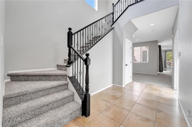 stairs featuring tile patterned floors