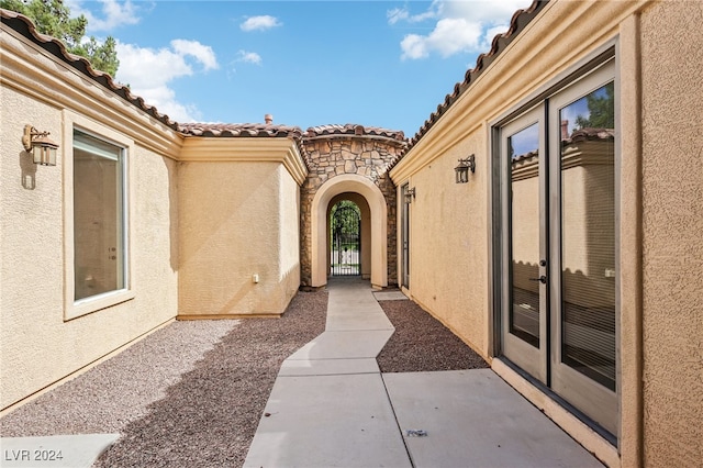 property entrance with a patio