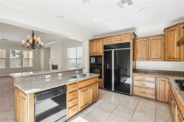 kitchen featuring a wealth of natural light, sink, black appliances, and ornamental molding