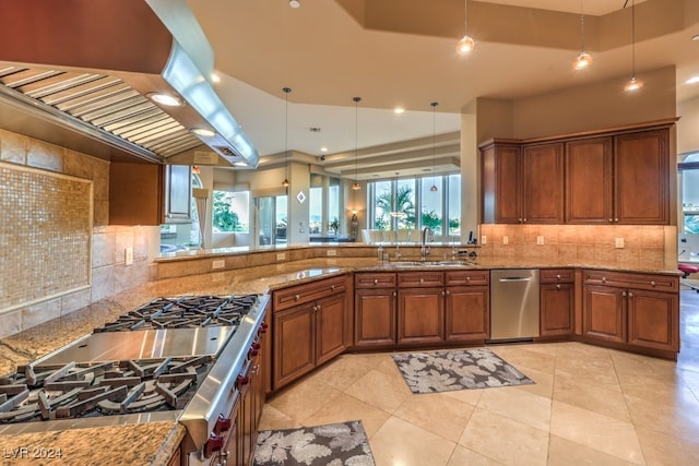 kitchen with stainless steel dishwasher, sink, decorative light fixtures, extractor fan, and light stone counters