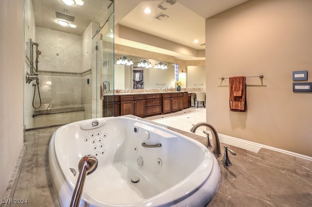 bathroom with vanity and independent shower and bath