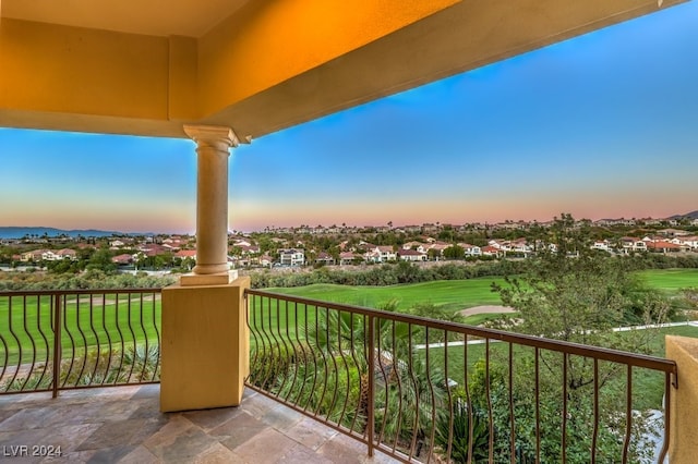 view of balcony at dusk