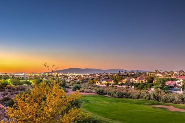 view of property's community featuring a mountain view and a lawn