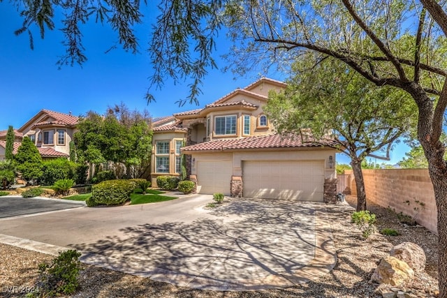 mediterranean / spanish-style home featuring a garage