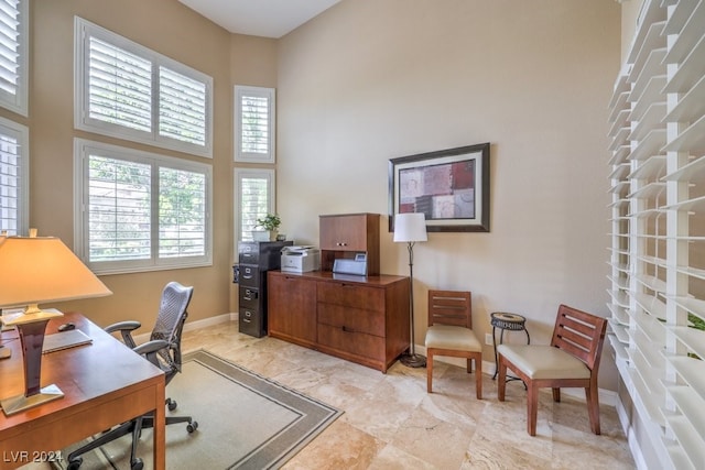 home office with a towering ceiling