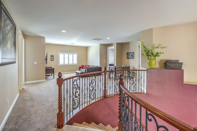 staircase with carpet flooring