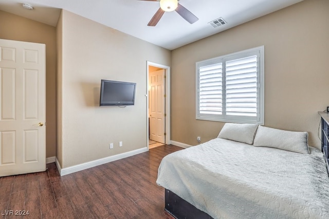 bedroom featuring ceiling fan and dark wood-type flooring