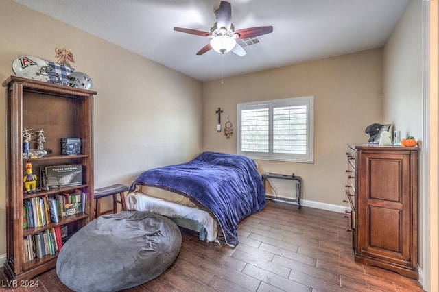 bedroom featuring ceiling fan and dark hardwood / wood-style floors