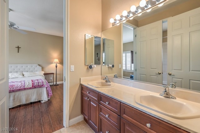 bathroom featuring wood-type flooring, vanity, and ceiling fan