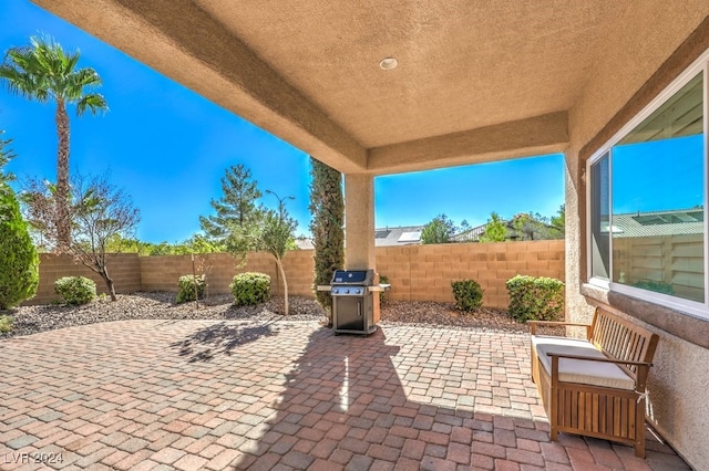 view of patio featuring a grill