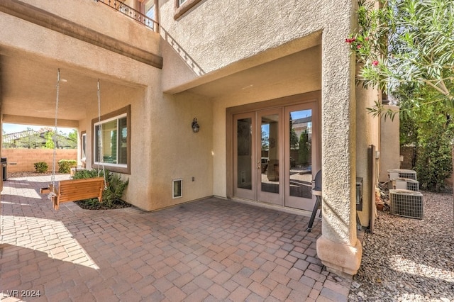 view of patio / terrace featuring french doors and central AC unit