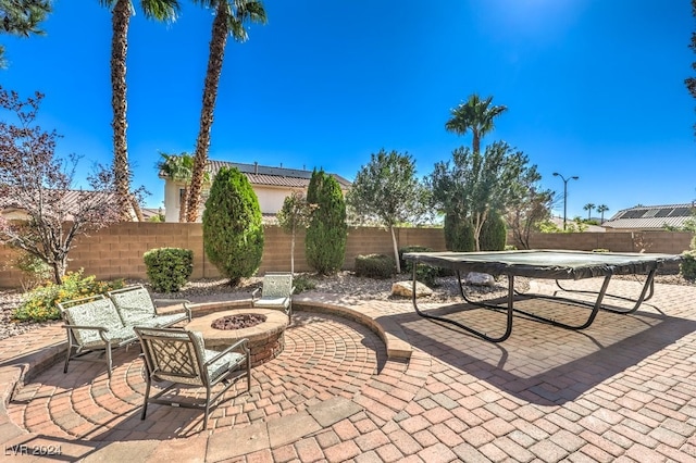 view of patio with a fire pit