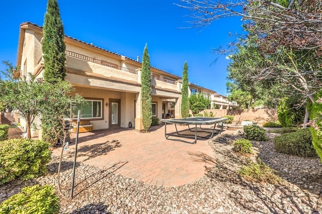 back of house featuring a patio area