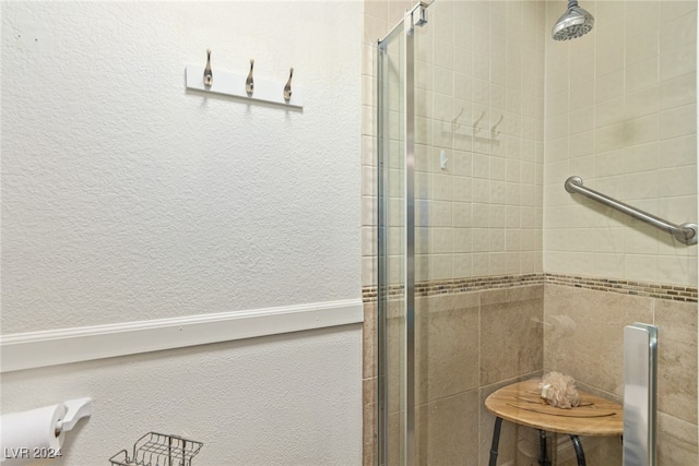 bathroom featuring an enclosed shower