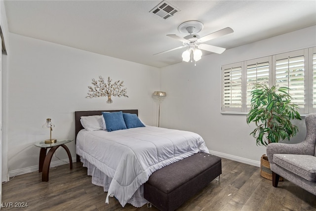 bedroom with ceiling fan and dark hardwood / wood-style floors