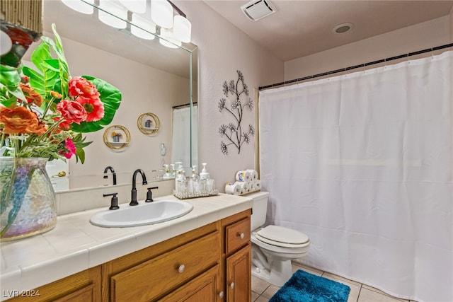 bathroom featuring vanity, tile patterned flooring, toilet, and a shower with shower curtain