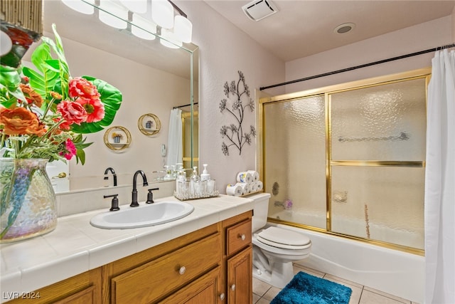 full bathroom with shower / bath combination with curtain, tile patterned floors, vanity, and toilet