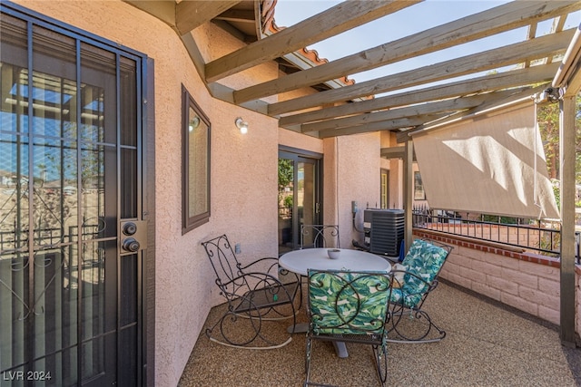 view of patio / terrace with central AC and a pergola