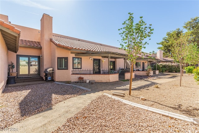 back of property with a patio and ceiling fan