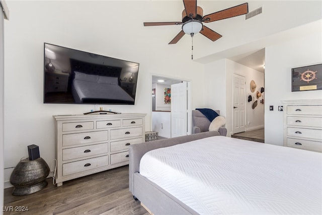 bedroom with ceiling fan and hardwood / wood-style floors