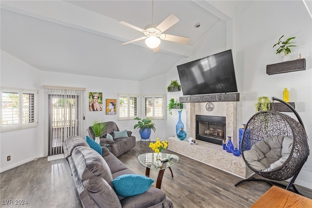 living room with ceiling fan, a fireplace, hardwood / wood-style floors, and a wealth of natural light