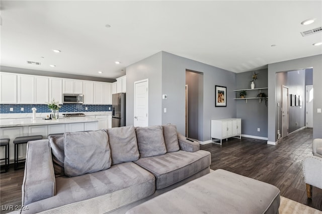 living room with dark hardwood / wood-style flooring