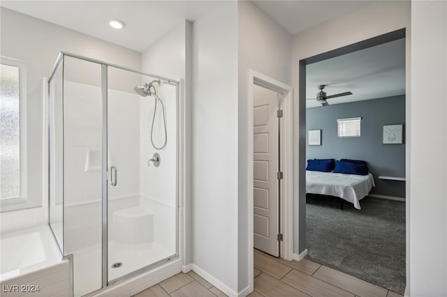 bathroom with shower with separate bathtub, hardwood / wood-style floors, and ceiling fan