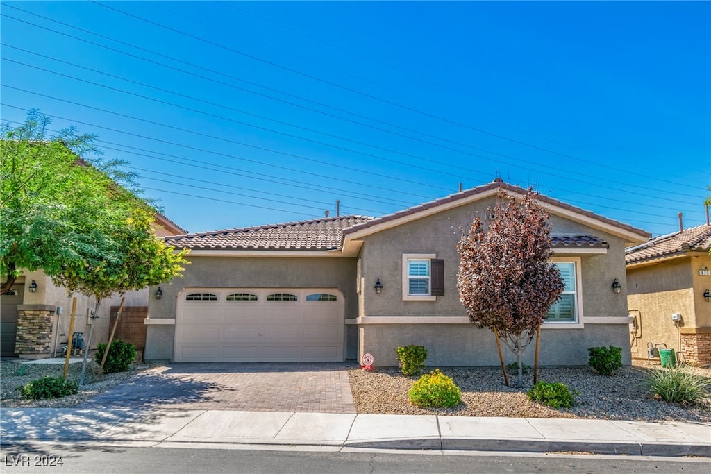 view of front of property with a garage