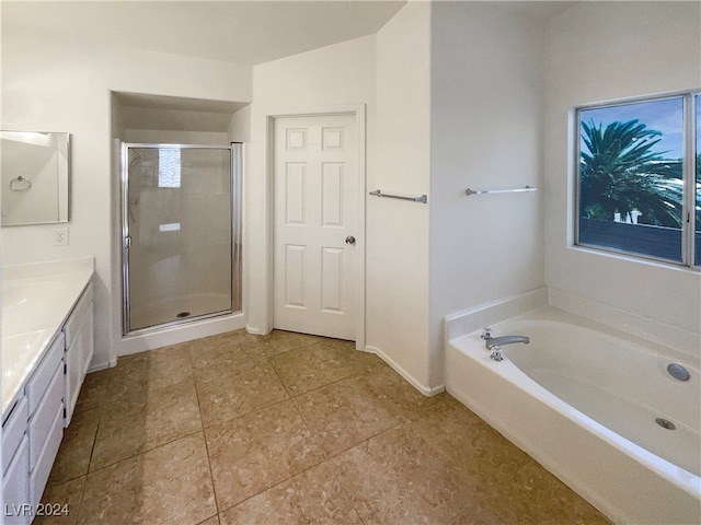 bathroom with shower with separate bathtub and vanity