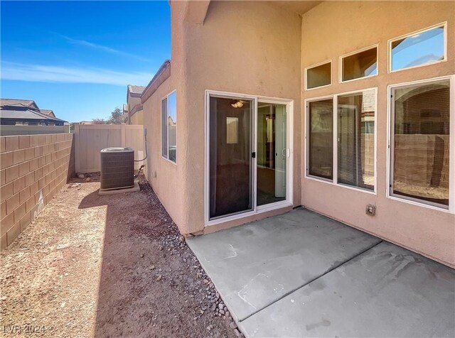 exterior space with a patio and central AC