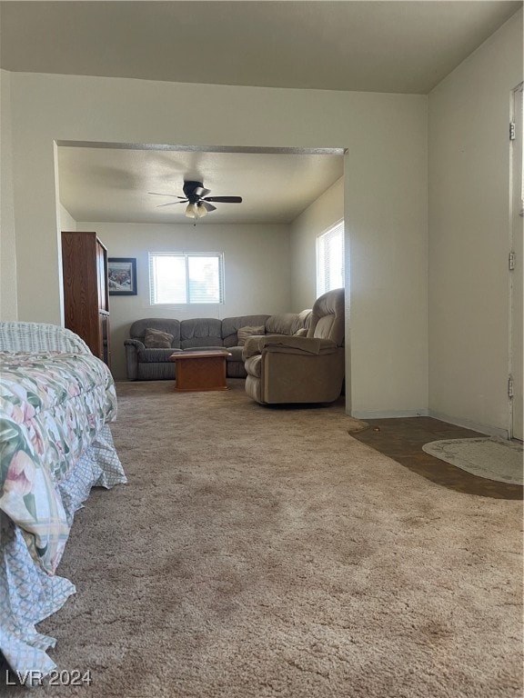 carpeted bedroom featuring ceiling fan