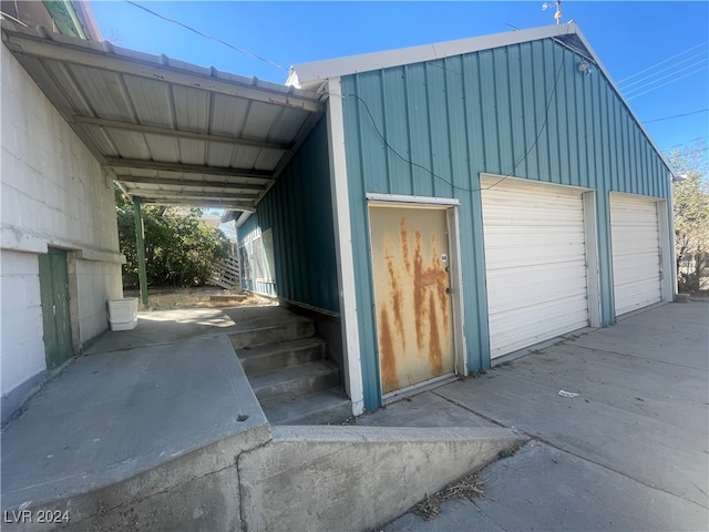 garage featuring a carport