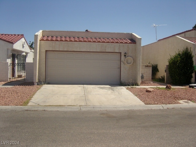 southwest-style home featuring a garage