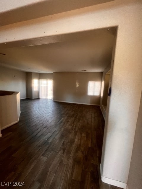 interior space with dark hardwood / wood-style floors and plenty of natural light