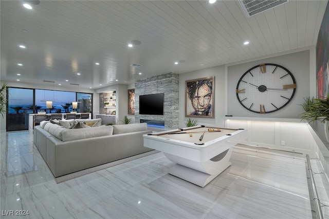 living room featuring wooden ceiling, a fireplace, and billiards