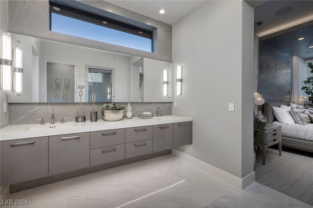 bathroom with decorative backsplash and vanity