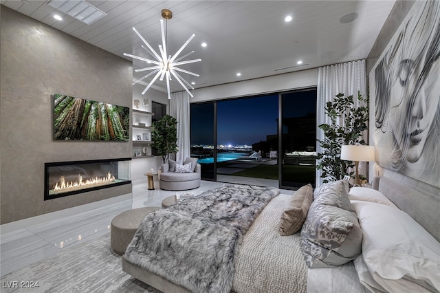 bedroom with access to outside and a chandelier