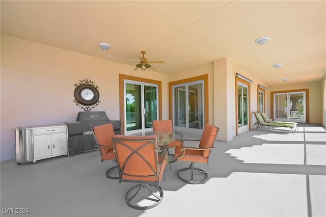 view of patio featuring ceiling fan