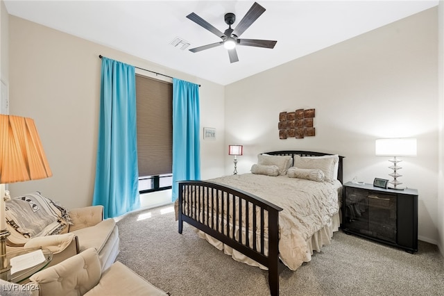 bedroom featuring ceiling fan and light carpet