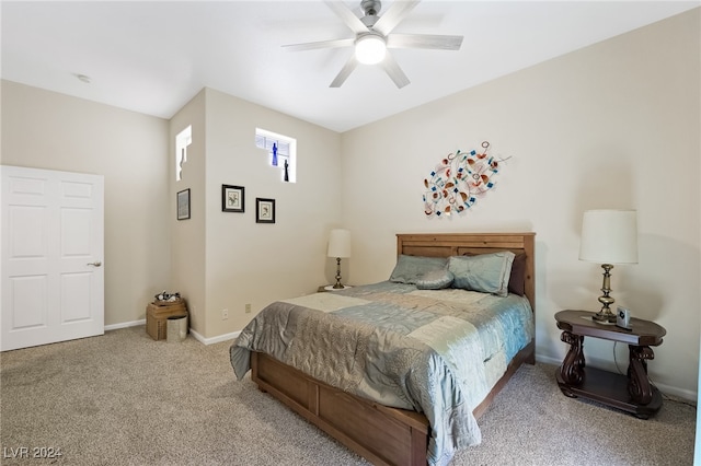 carpeted bedroom with ceiling fan