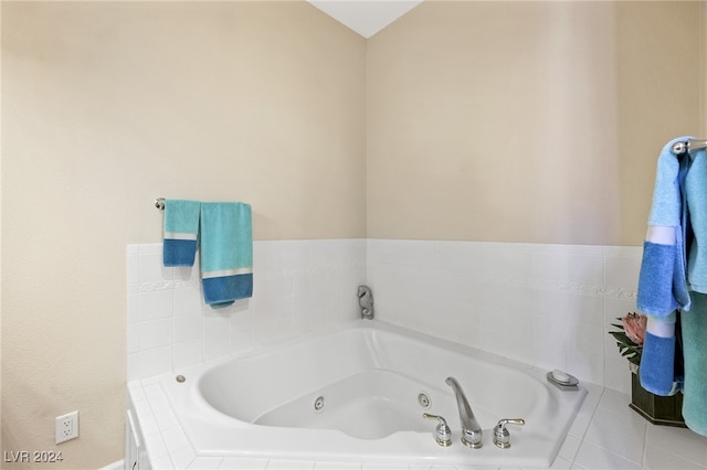 bathroom with tiled bath