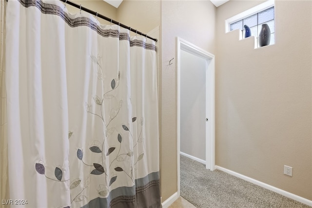 bathroom with a shower with shower curtain