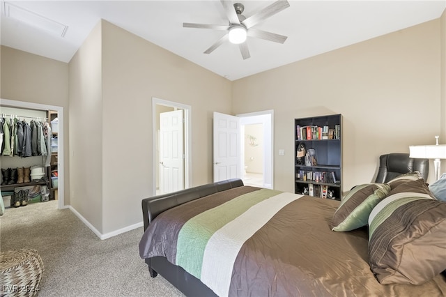 bedroom featuring ceiling fan, light colored carpet, and a closet