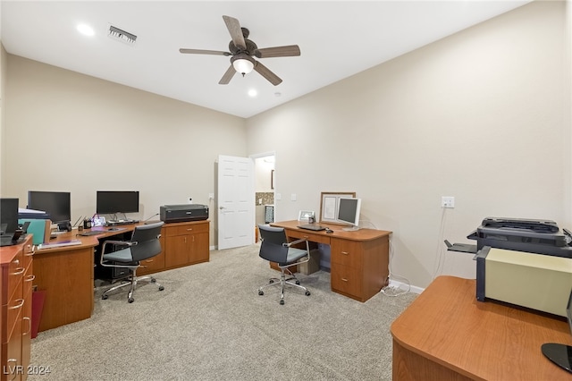 carpeted office with ceiling fan