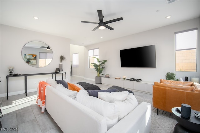 tiled living room featuring ceiling fan