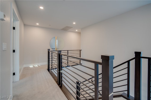 hallway with carpet floors