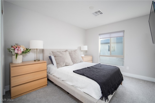 bedroom with light colored carpet