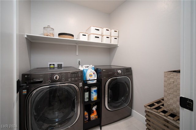 laundry room featuring washing machine and clothes dryer