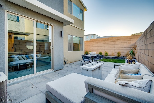 view of patio / terrace with cooling unit and an outdoor living space