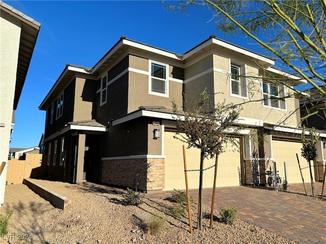 view of front of property with a garage